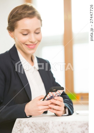 Foreign Female Teacher Looking At Her Phone Foreign Female Teacher Looking At Her Phone 27447726