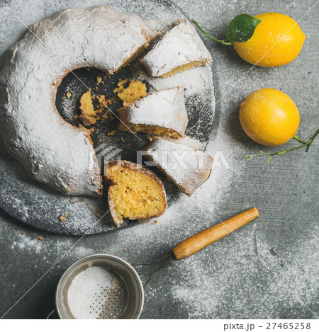 Homemade gluten-free lemon bundt cake over grey 27465258