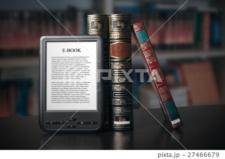 E-book reader device on desk in library 27466679