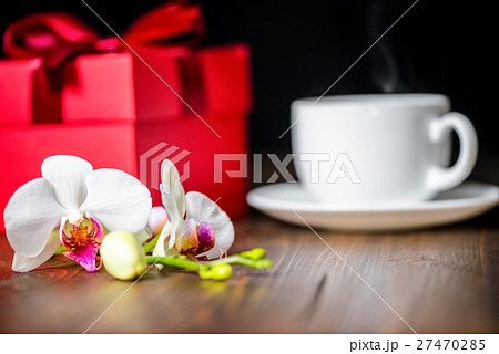 greeting red box with bow, orchid flower, greeting red box with bow, orchid flower, 27470285