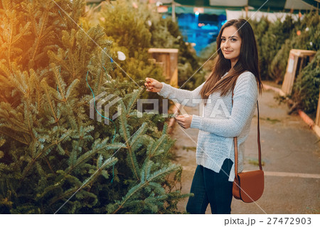 girl and Christmas tree 27472903