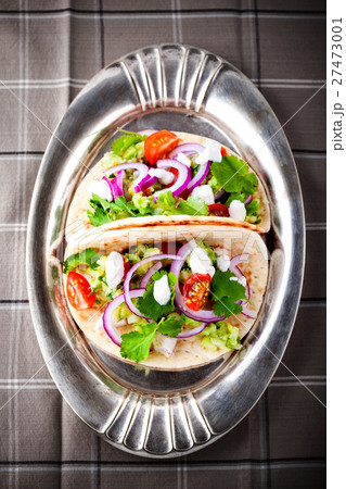 Chicken Tacos with vegetables on a pan Chicken Tacos with vegetables on a pan 27473001