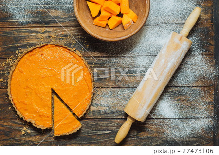Sliced pumpkin pie on a table 27473106