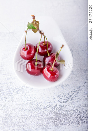 Cherries in a white dish 27474220