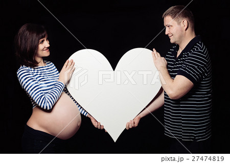 Pregnant Woman Holding her Hands in a Heart Shape Pregnant Woman Holding her Hands in a Heart Shape 27474819