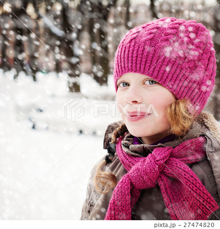 Cute Young Girl with Snow in Winter Park Outdoor 27474820