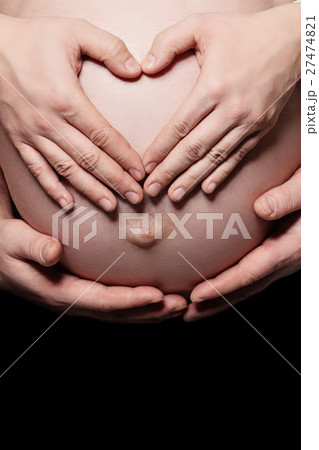 Parents Hands Making a Heart on the Belly Parents Hands Making a Heart on the Belly 27474821