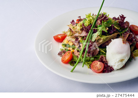 Arugula salad with goat cheese. 27475444