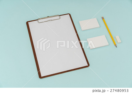 Clip board, paper,pencil and business card on blue background . 27480953