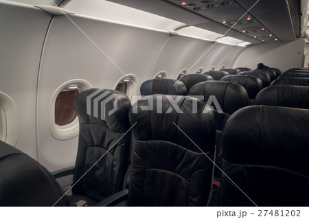 Airplane seats in the cabin ( Filtered image processed vintage effect. ) . 27481202