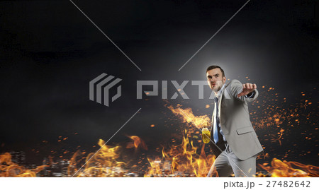 Businessman throwing petrol bomb Businessman throwing petrol bomb 27482642