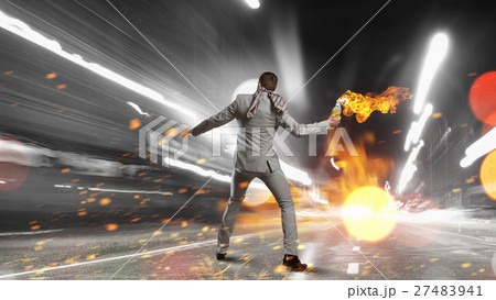Businessman throwing petrol bomb Businessman throwing petrol bomb 27483941