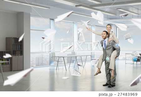 Businesspeople having fun in office Businesspeople having fun in office 27483969