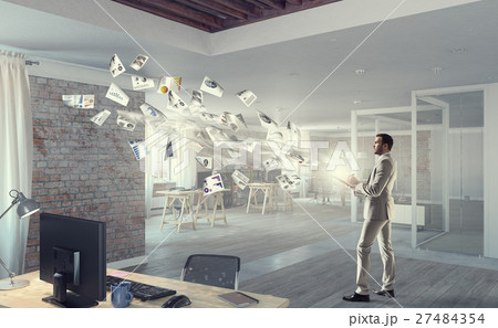 Handsome busy businessman making notes 27484354