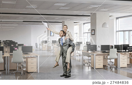 Businesspeople having fun in office Businesspeople having fun in office 27484836
