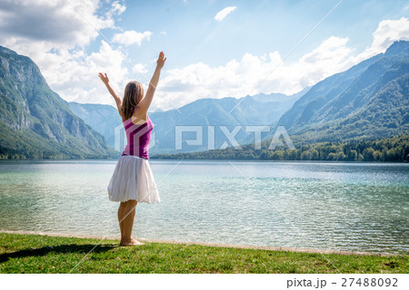 Woman meditating at the lake 27488092