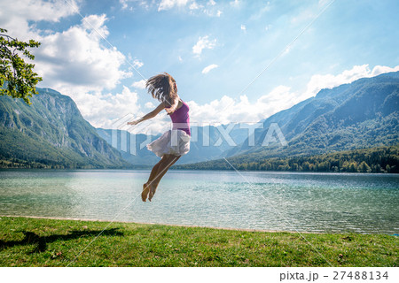 Girl jumping on the lake 27488134