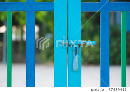 Pink color fence with safety lock at kindergarten. Pink color fence with safety lock at kindergarten. 27489411