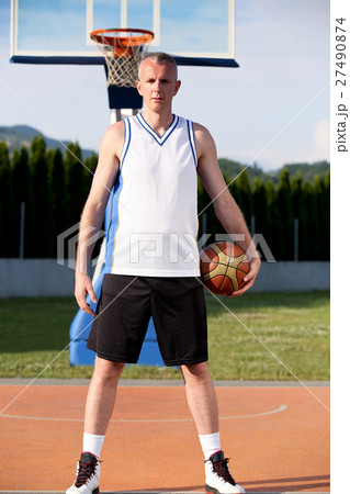 Portrait of young man street basket player 27490874