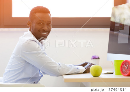 young african american businessman working on 27494314