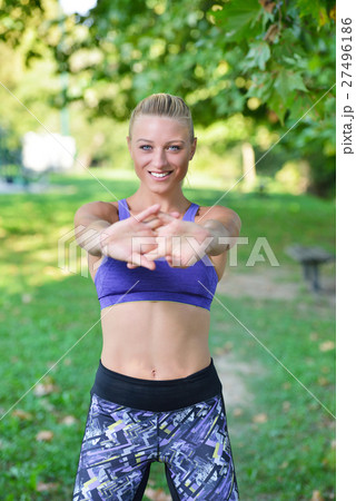Young girl stretching outdoors. Jogging - workout Young girl stretching outdoors. Jogging - workout 27496186
