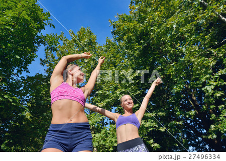 Two woman practicing working out - fitness outdoor 27496334
