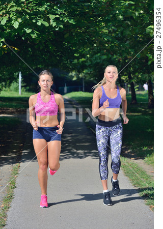 Two woman practicing working out - fitness outdoor 27496354