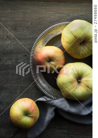 Apples on the dark scratched table top view 27498660