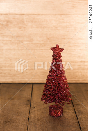 Christmas red pine tree stand on wooden table Christmas red pine tree stand on wooden table 27500085