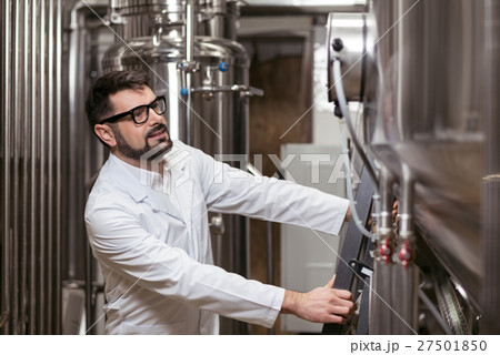 Handsome man working on factory Handsome man working on factory 27501850