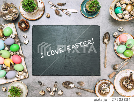 Easter table deco colored Holidays background Easter table deco colored Holidays background 27502884