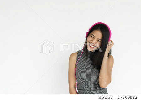 Cheerful Girl Standing Listen Music Headphones Concept Cheerful Girl Standing Listen Music Headphones Concept 27509982