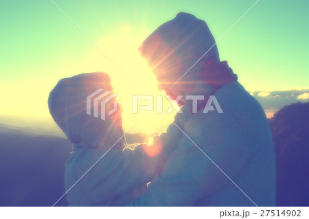 Silhouette of couples happy at scenic mountain fog Silhouette of couples happy at scenic mountain fog 27514902