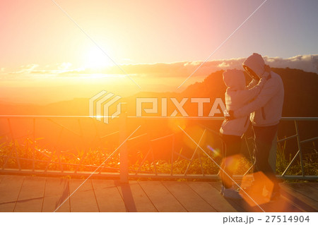 Silhouette of couples happy at scenic mountain fog Silhouette of couples happy at scenic mountain fog 27514904