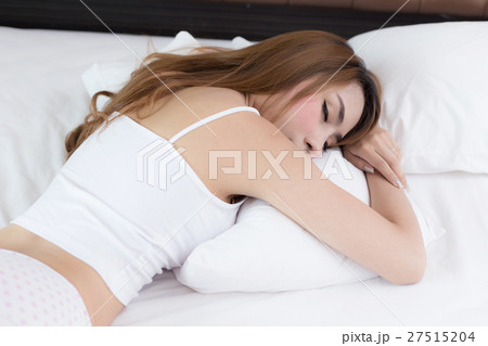 young beautiful woman sleeping on bed young beautiful woman sleeping on bed 27515204