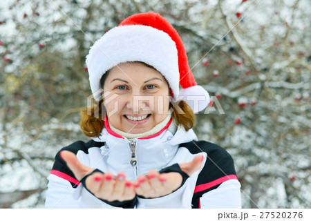 middle-aged Woman in cap Santa Claus middle-aged Woman in cap Santa Claus 27520276