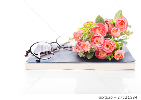 Work space with notebook,glasses and rose bouquet Work space with notebook,glasses and rose bouquet 27521534