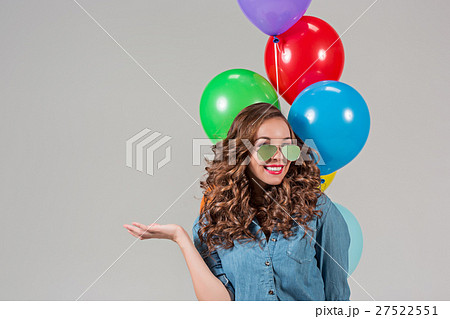 girl with sunglasses and bunch of colorful 27522551