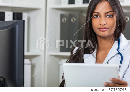 Asian Indian Female Woman Hospital Doctor With Tablet Computer Asian Indian Female Woman Hospital Doctor With Tablet Computer 27526743