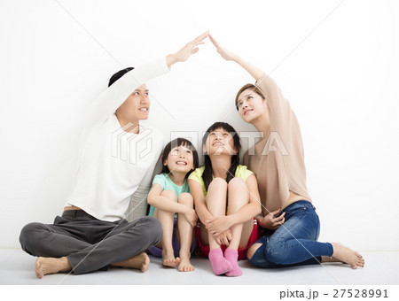 happy family sitting together and making the home sign happy family sitting together and making the home sign 27528991