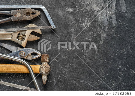 Set of tools on dark cement background 27532663