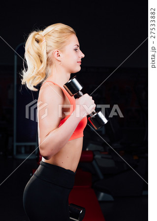sexy girl doing exercises in her arms biceps and sexy girl doing exercises in her arms biceps and 27533882