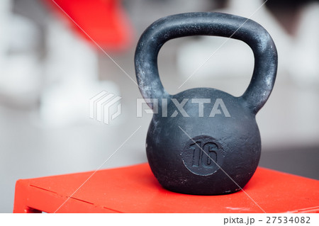 Large cast-iron sixteen pound weight dumbbell on 27534082