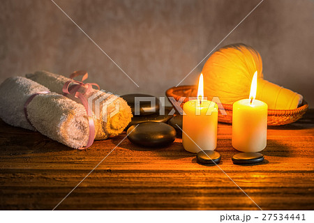 spa composition of white towels, candles  27534441