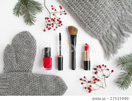 Winter cosmetics and clothes on white. Flat lay Winter cosmetics and clothes on white. Flat lay 27535990