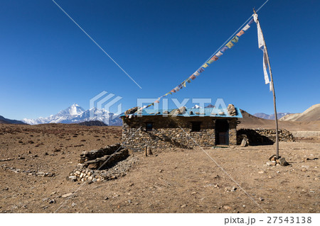 stone house with colored flags  27543138
