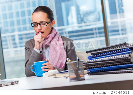 Young businesswoman sick in the office 27544011