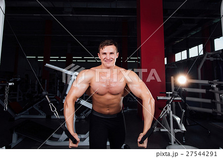 big strong bodybuider without shirts demonstrate 27544291
