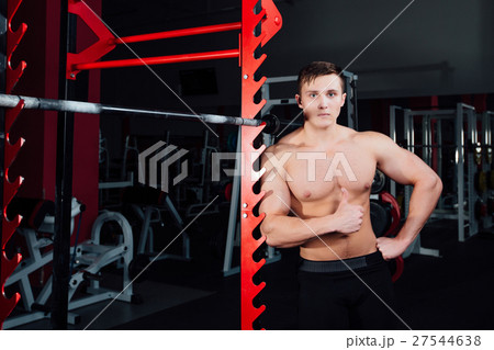 portrait of a handsome athlete at gym. man does portrait of a handsome athlete at gym. man does 27544638