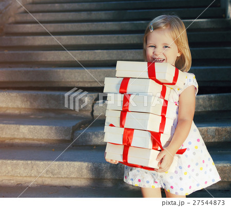 Gift boxes in the hands of little cute girl 27544873